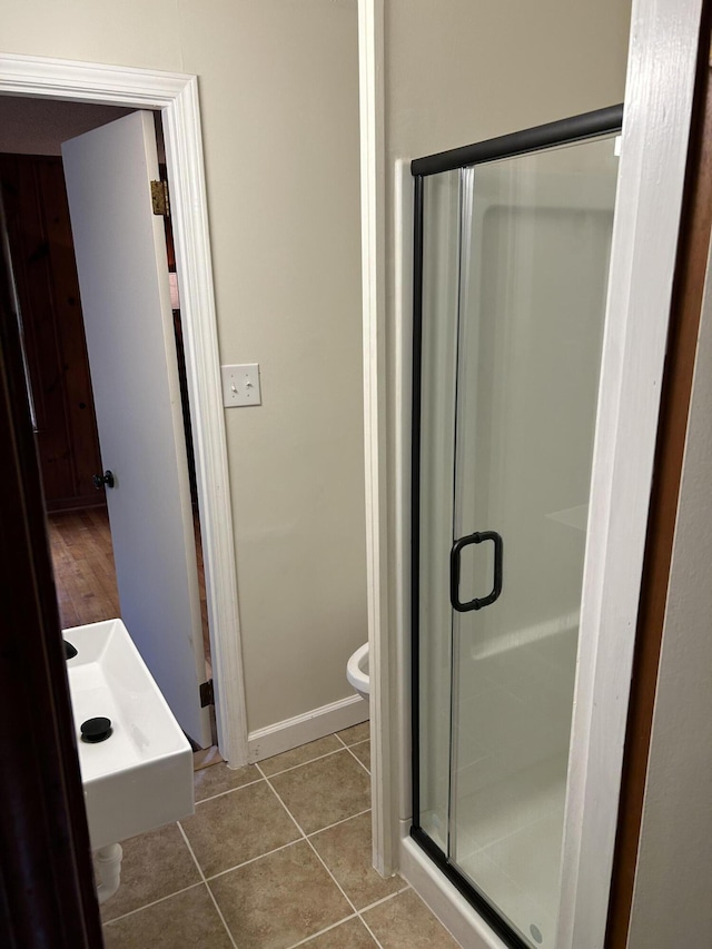 3007 Meadowbrook Dr, Augusta, GA 30906 - bathroom with a shower stall, toilet, tile patterned flooring, and baseboards