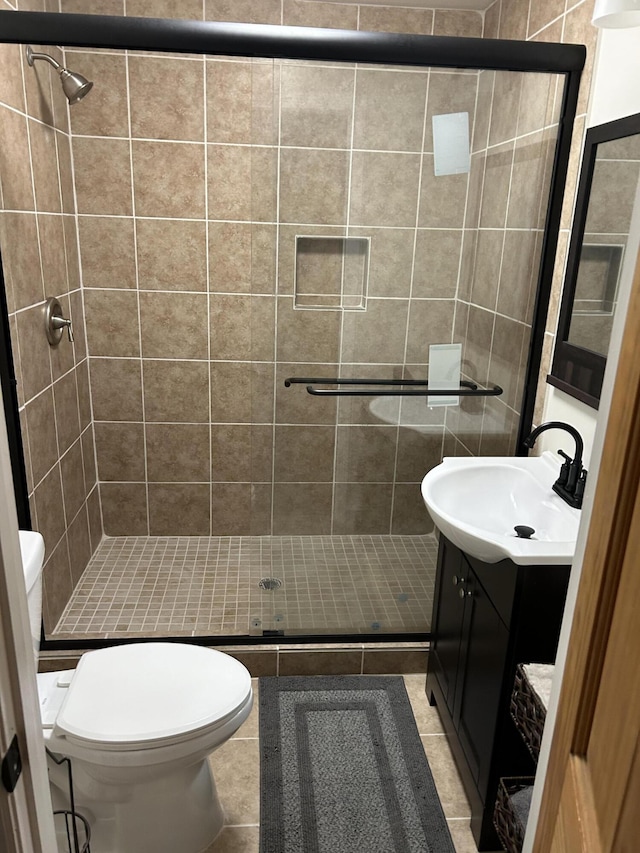 3007 Meadowbrook Dr, Augusta, GA 30906 - bathroom with vanity, a shower stall, tile patterned flooring, and toilet
