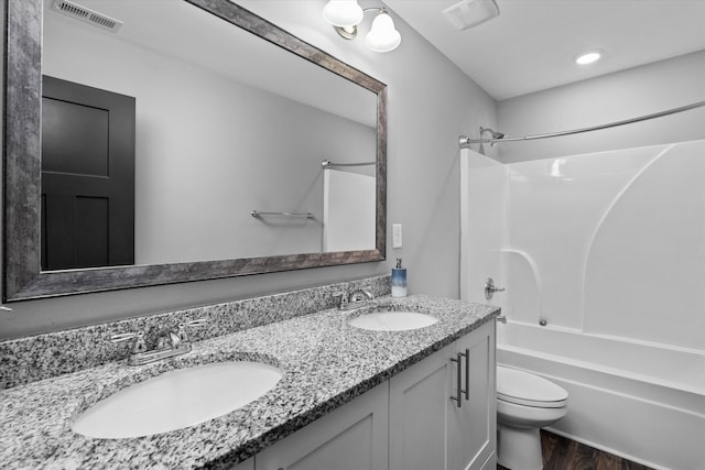 268 Anneswood Rd, Martinez, GA 30907 - bathroom with tub / shower combination, double vanity, toilet, and wood finished floors