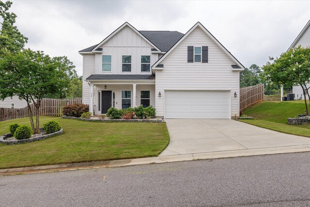 268 Anneswood Rd, Martinez, GA 30907 - traditional-style home featuring a garage, driveway, board and batten siding, central air condition unit, and roof with shingles