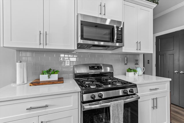 268 Anneswood Rd, Martinez, GA 30907 - kitchen with appliances with stainless steel finishes, crown molding, white cabinets, decorative backsplash, and light stone counters