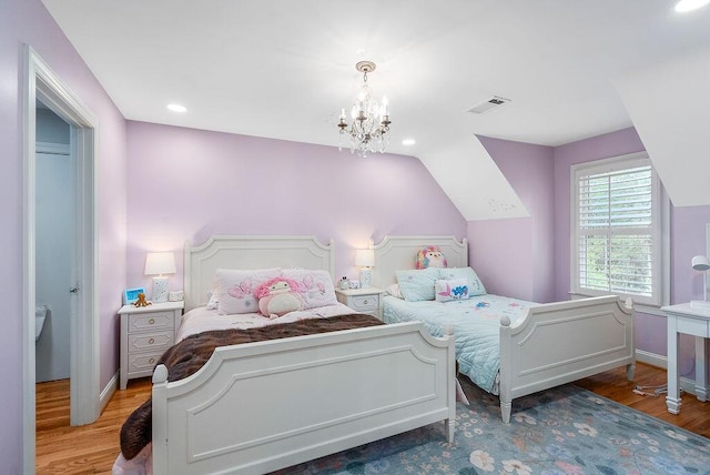 153 Longwood Green Ct, Aiken, SC 29803 - bedroom with baseboards, visible vents, wood finished floors, and an inviting chandelier