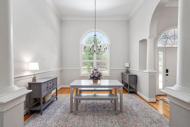 153 Longwood Green Ct, Aiken, SC 29803 - dining space with crown molding, plenty of natural light, ornate columns, and wood finished floors