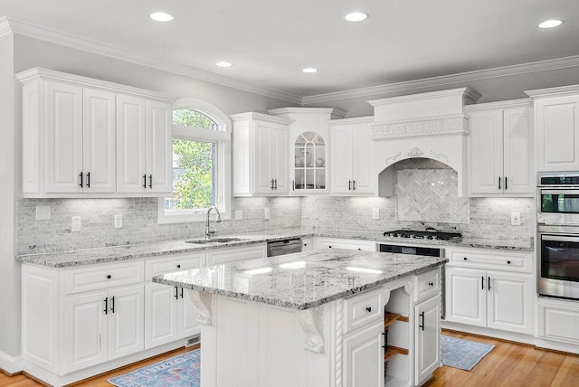 153 Longwood Green Ct, Aiken, SC 29803 - kitchen featuring glass insert cabinets, white cabinetry, a sink, light wood finished floors, and stainless steel appliances