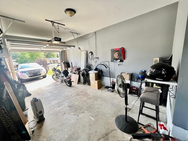 garage featuring a garage door opener