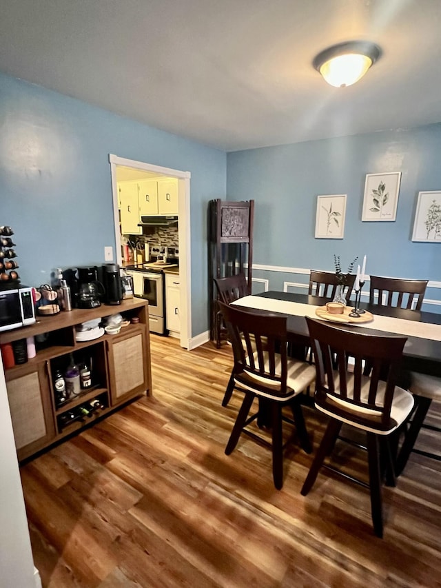 dining room featuring hardwood / wood-style flooring