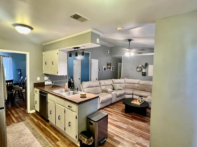 kitchen featuring white cabinets, dishwasher, ceiling fan, and sink