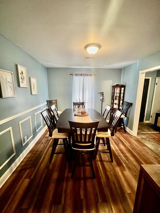 dining area featuring hardwood / wood-style flooring