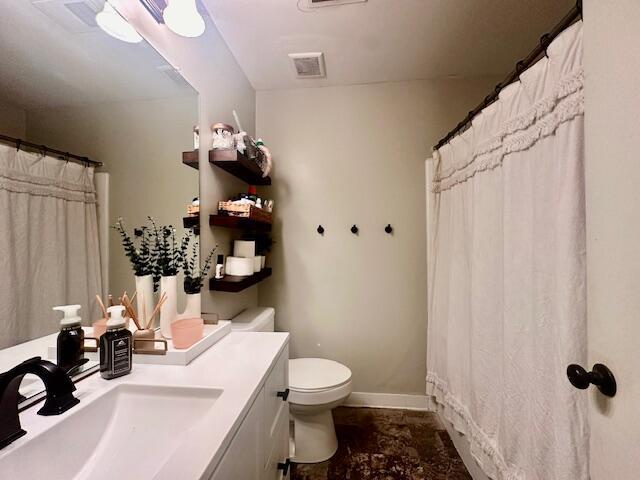 bathroom with vanity and toilet