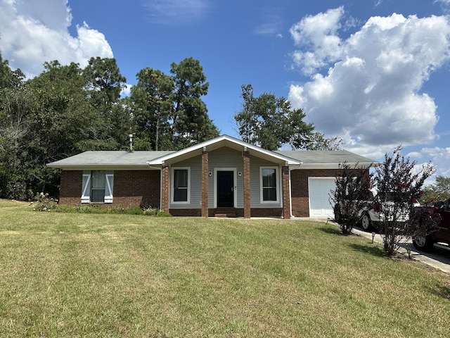 ranch-style house featuring a garage and a front yard