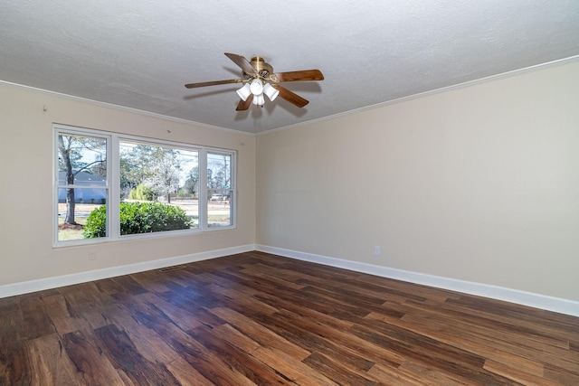 unfurnished room featuring ceiling fan, baseboards, ornamental molding, a textured ceiling, and dark wood-style flooring