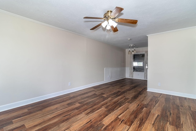 empty room with a textured ceiling, dark wood-type flooring, crown molding, and ceiling fan with notable chandelier