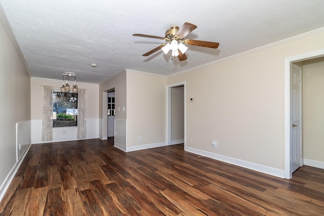 empty room featuring wood finished floors, a textured ceiling, ceiling fan, and crown molding