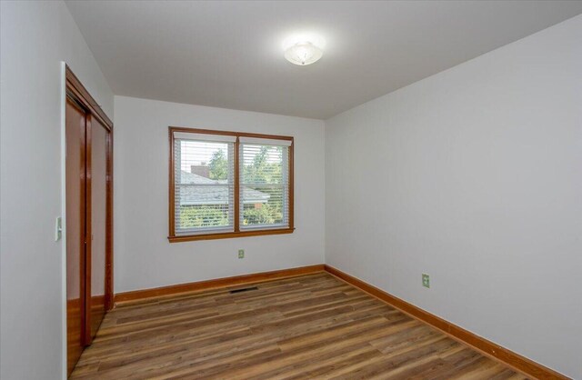 418 Kemp Dr, Augusta, GA 30909 - unfurnished bedroom with wood finished floors and a closet