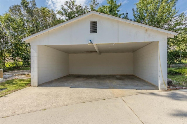 418 Kemp Dr, Augusta, GA 30909 - garage with concrete driveway and a detached carport
