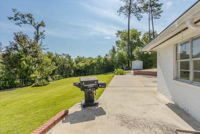 418 Kemp Dr, Augusta, GA 30909 - view of patio with a shed, grilling area, and view of wooded area