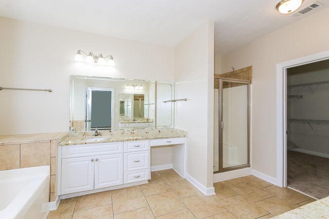 bathroom featuring vanity, tile patterned floors, and independent shower and bath