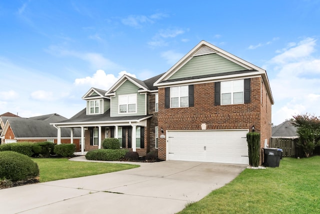 view of front of property featuring a front yard and a garage