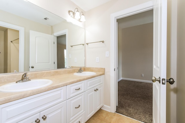 bathroom with tile patterned flooring and vanity