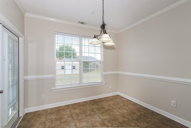 empty room featuring crown molding