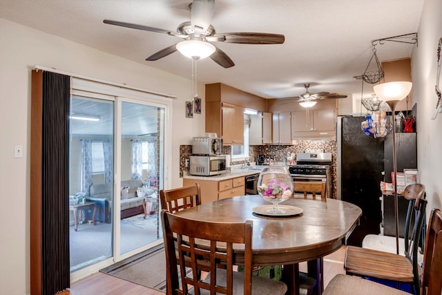 431 Edgar Cir, Thomson, GA 30824 - dining room with a ceiling fan and light wood finished floors