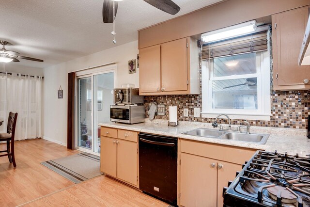 431 Edgar Cir, Thomson, GA 30824 - kitchen with black dishwasher, ceiling fan, stainless steel microwave, a sink, and light countertops