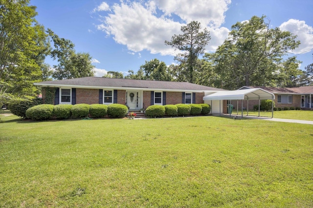 431 Edgar Cir, Thomson, GA 30824 - ranch-style house with a detached carport, a front lawn, brick siding, and driveway