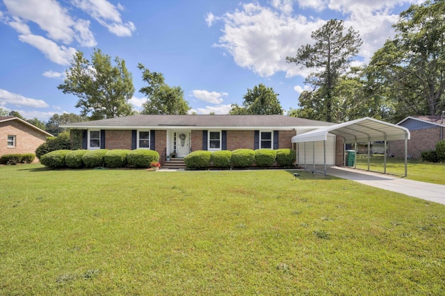 431 Edgar Cir, Thomson, GA 30824 - ranch-style house featuring a front yard, brick siding, a carport, and concrete driveway