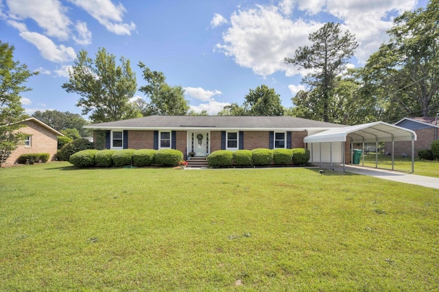 431 Edgar Cir, Thomson, GA 30824 - view of front of house with brick siding, a front yard, a detached carport, and concrete driveway