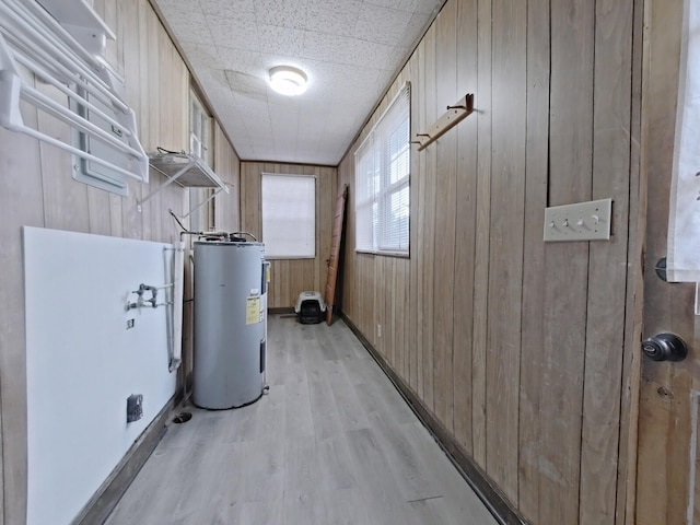 utility room with electric water heater