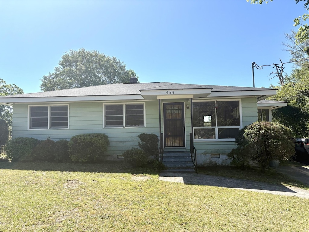 view of front of house featuring crawl space, entry steps, and a front yard