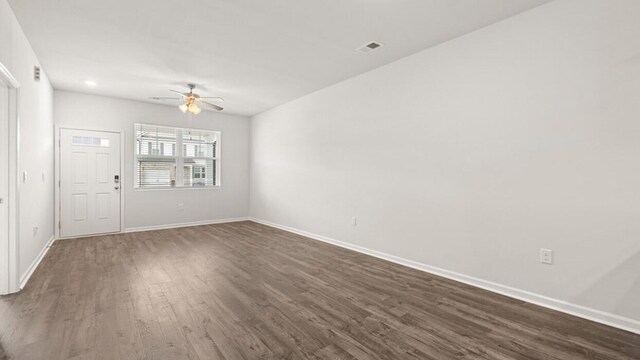 unfurnished room featuring ceiling fan and dark hardwood / wood-style floors