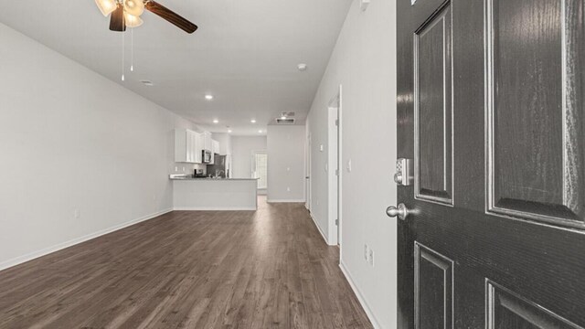 foyer entrance featuring ceiling fan and dark hardwood / wood-style flooring