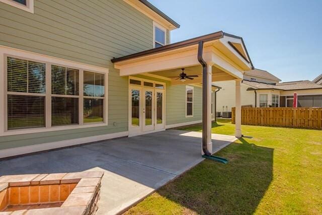 back of house featuring fence, a patio area, french doors, a yard, and ceiling fan