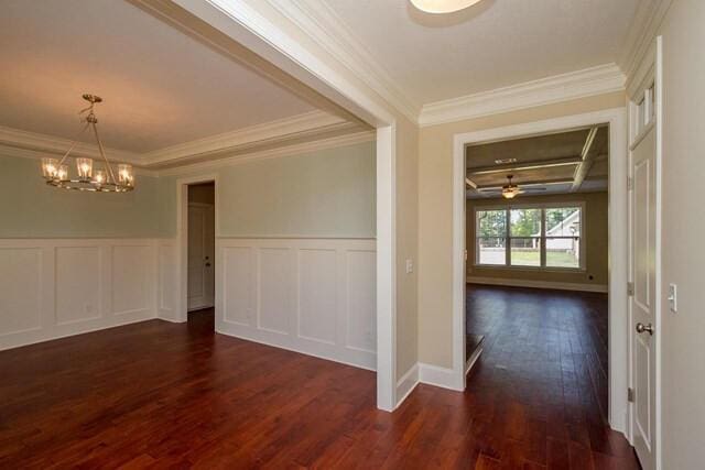 interior space featuring ornamental molding, a decorative wall, and dark wood-type flooring