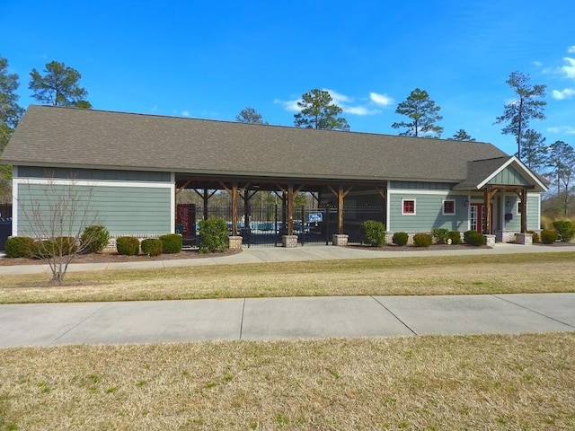 view of home's community featuring a yard and fence