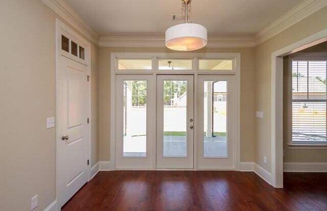 entryway with baseboards, dark wood-style flooring, french doors, and crown molding