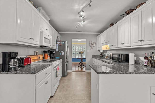 kitchen with ornamental molding, white appliances, sink, light tile patterned floors, and white cabinets