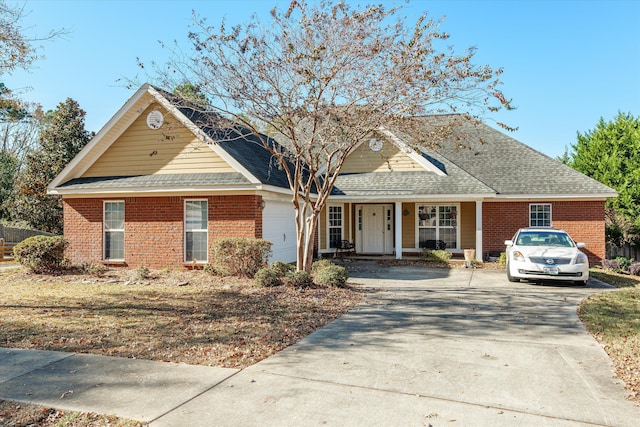 view of front of house with a garage and covered porch