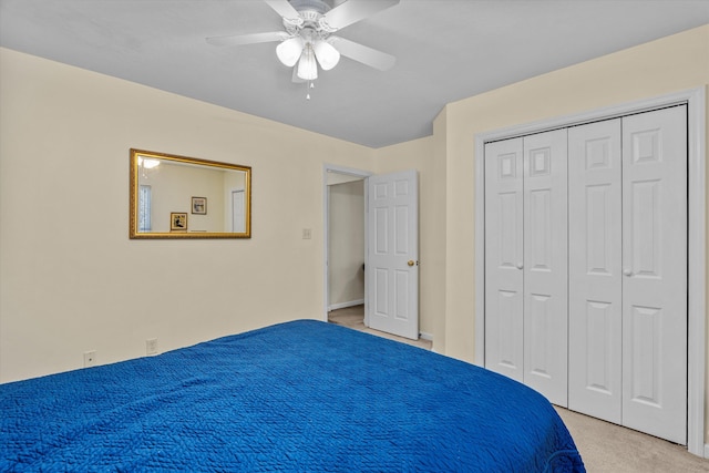 unfurnished bedroom with ceiling fan, light carpet, and a closet