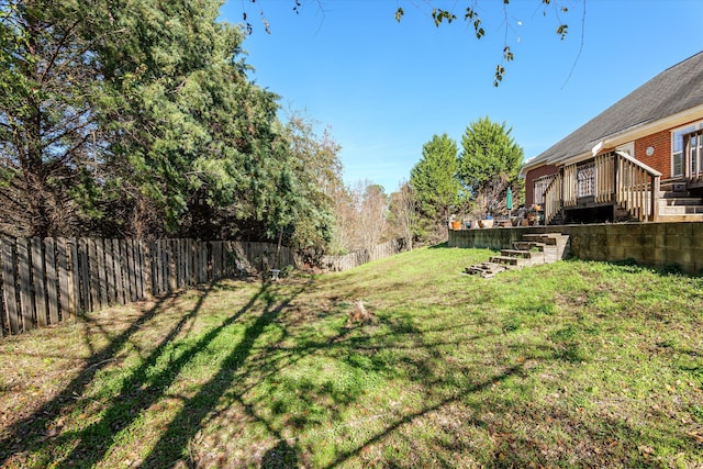 view of yard featuring a deck