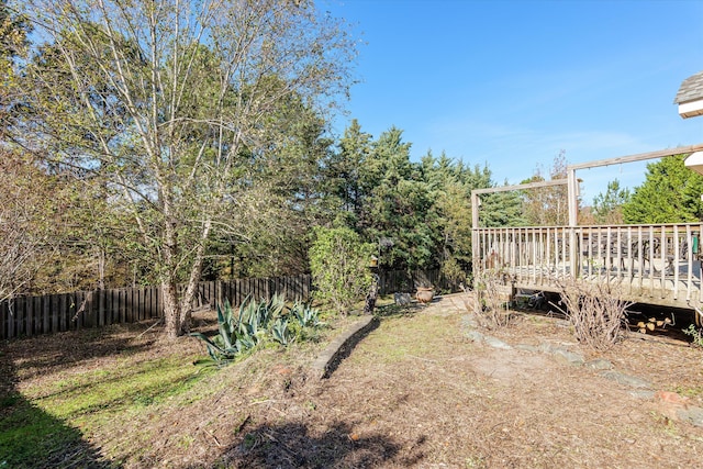 view of yard featuring a wooden deck