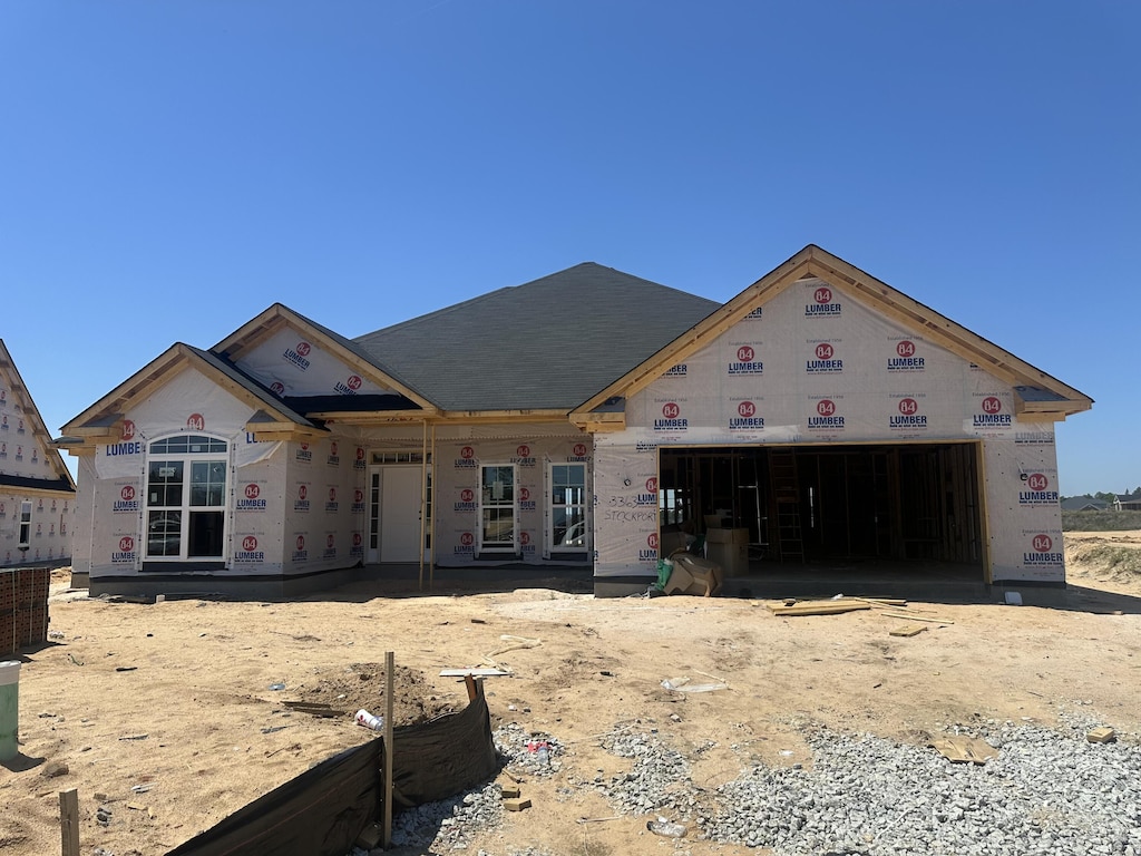 property in mid-construction featuring a garage