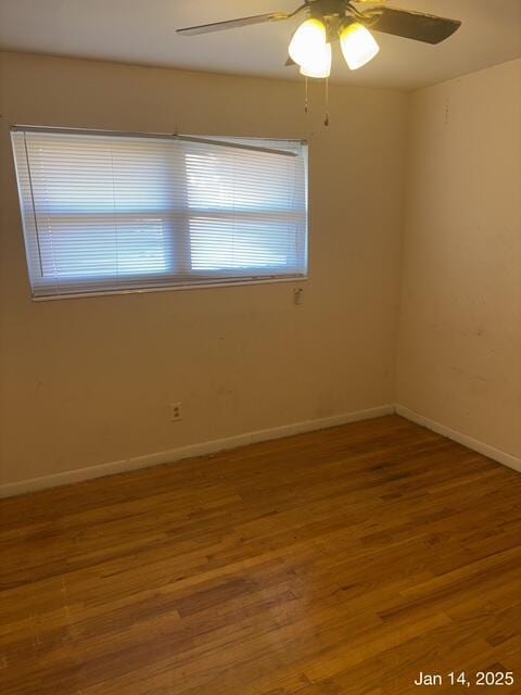 unfurnished room featuring hardwood / wood-style floors and ceiling fan