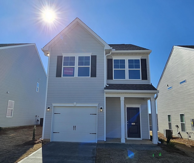 view of front of house featuring a garage and covered porch