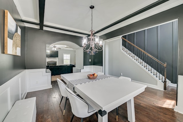 251 Wentworth Pl, Grovetown, GA 30813 - dining room with a decorative wall, a chandelier, dark wood-type flooring, a fireplace, and stairs