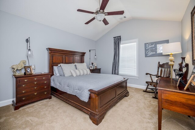 bedroom featuring light carpet, vaulted ceiling, and ceiling fan