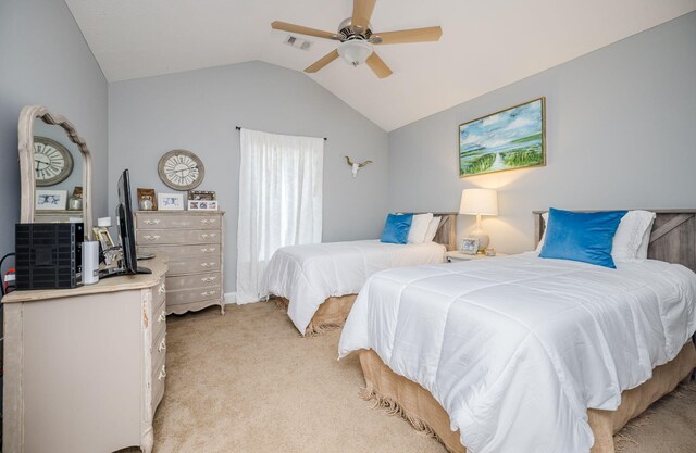 carpeted bedroom featuring ceiling fan and lofted ceiling