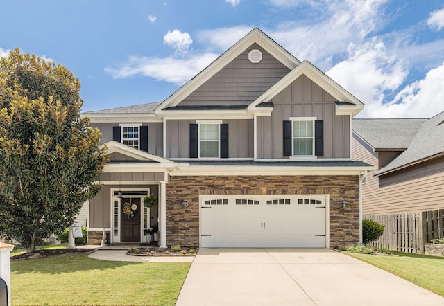 craftsman inspired home with a front yard and a garage