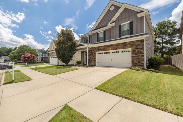 craftsman-style house with a garage and a front yard